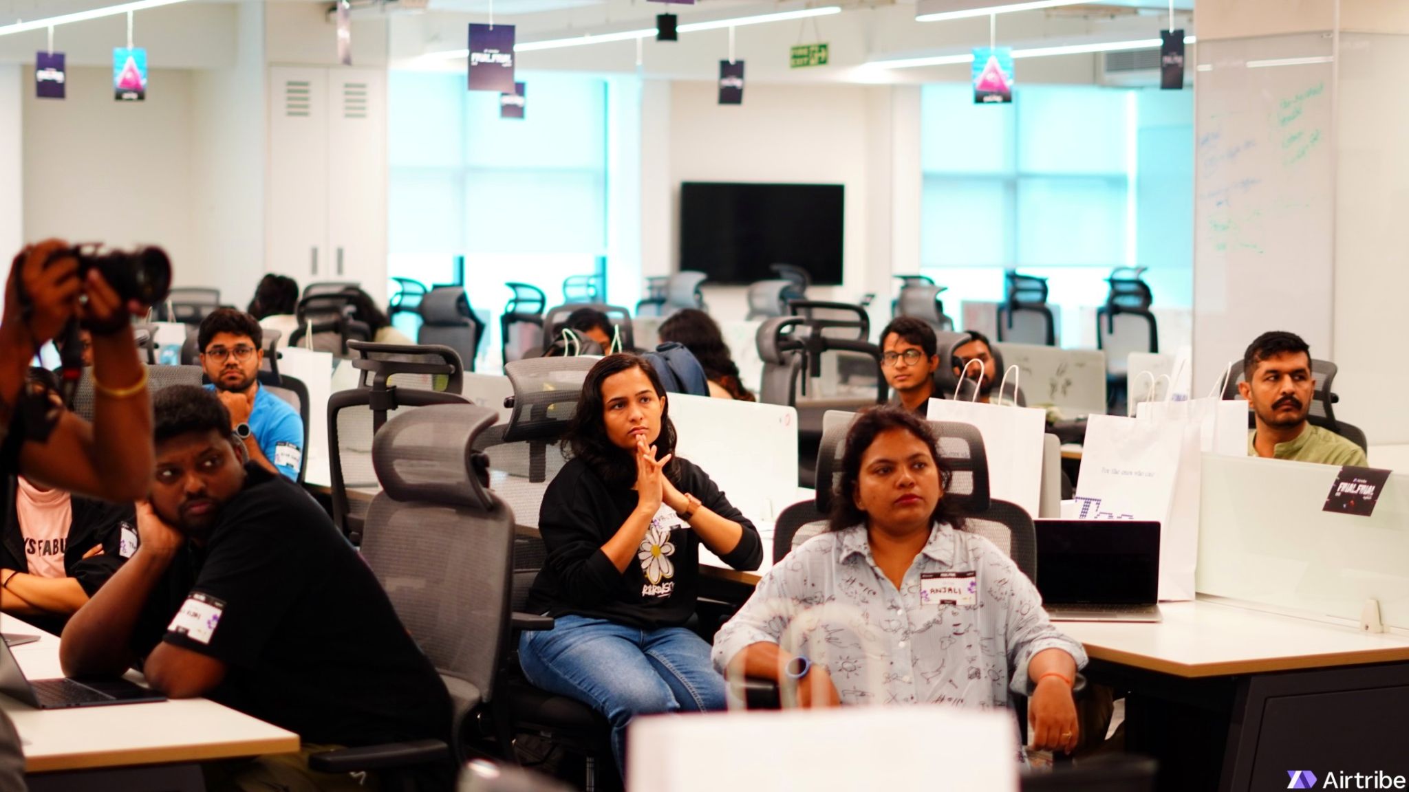 Heads-down at the Airtribe build day — laptops open, whiteboards full