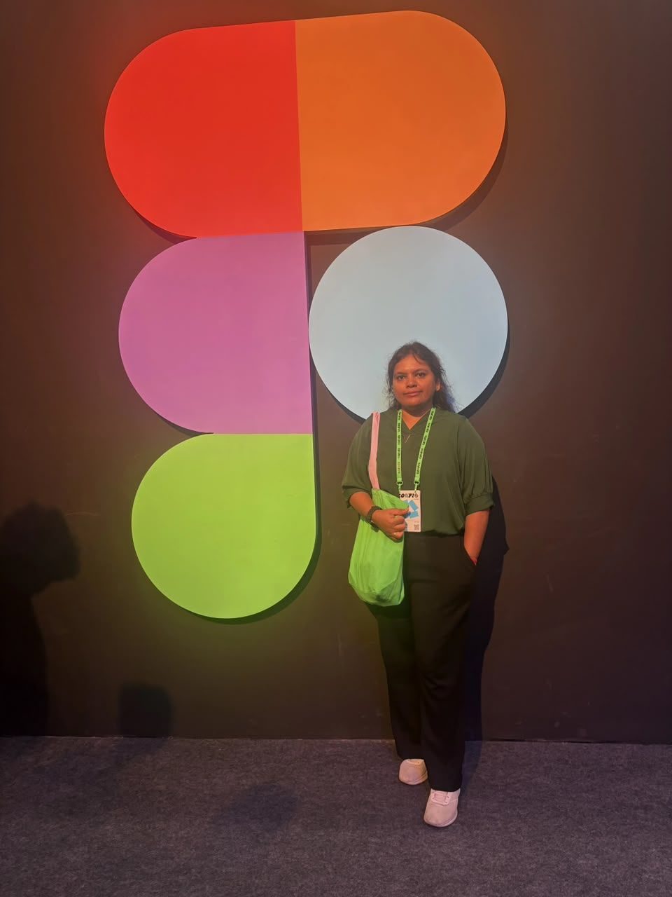Standing in front of the Figma logo at Config India